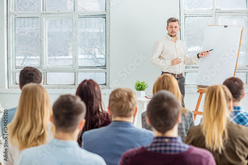 Speaker at Business Meeting in the conference hall.