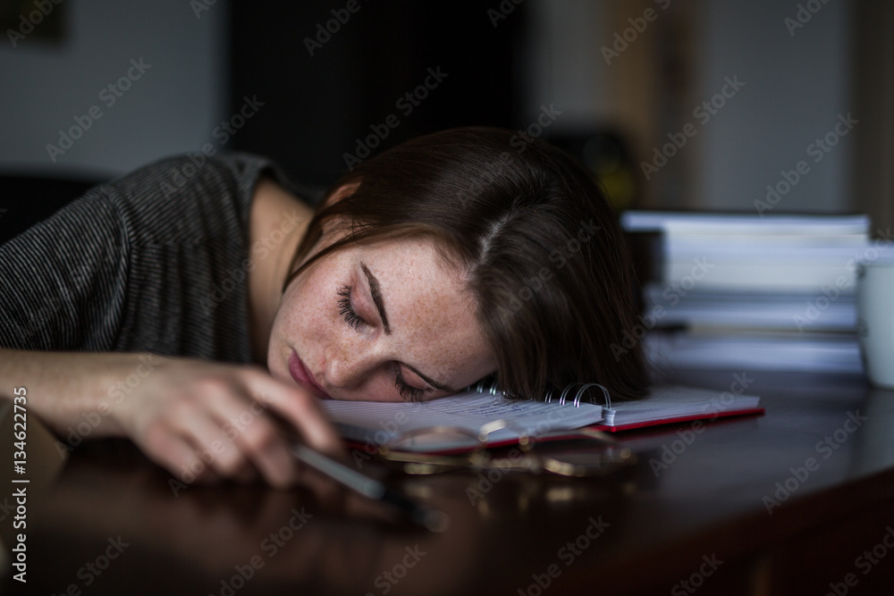 Tired student napping on desk Tired student napping on desk