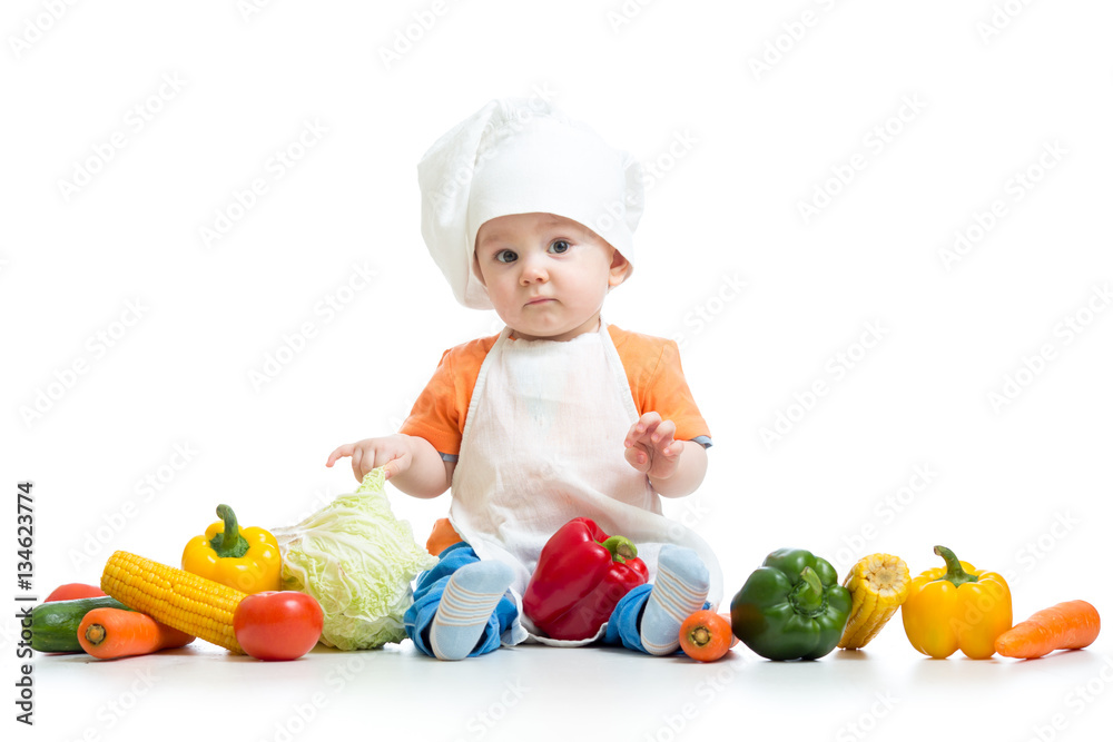 Chef child boy with vegetables isolated on white background Chef child boy with vegetables isolated on white background