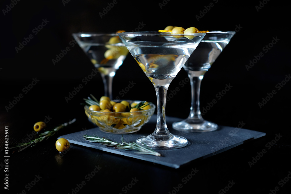 Margarita cocktail alcohol drink in glass with green olives