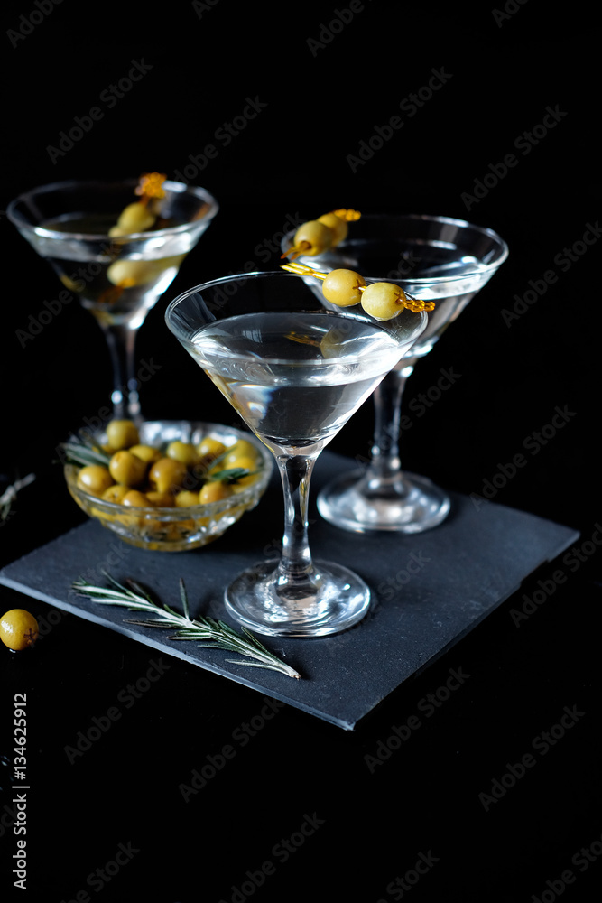 Margarita cocktail alcohol drink in glass with green olives
