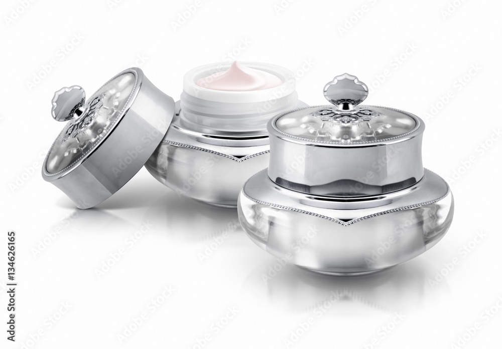 Two silver deluxe cosmetic jar on white background