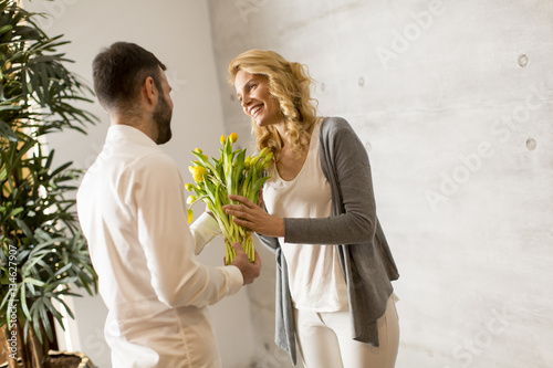 Young man giving to girl a ...
