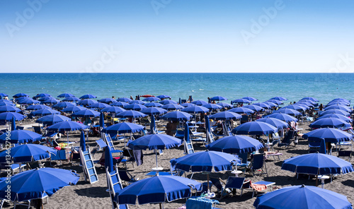beach full of umbrellas in the Mediterranean Sea in Italy © Italyteam
