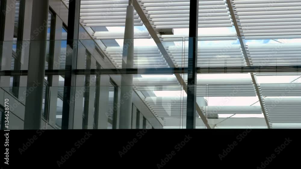 Businesspeople walking in office corridor at workplace 4k