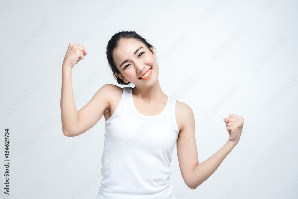 Happy asian young woman beautiful smile with ok fight gesture isolated on white background Happy asian young woman beautiful smile with ok fight gesture isolated on white background
