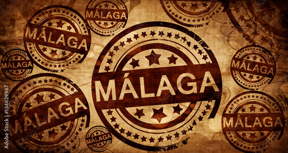 Malaga, vintage stamp on paper background