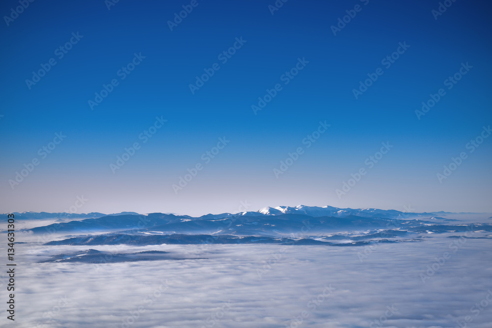View of clouds covered Tatra mountain peaks
