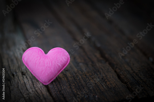 The pink heart for love on hard wood wiht dark tone