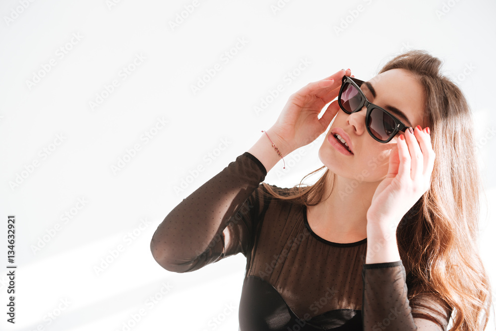 Young beautiful lady wearing sunglasses Young beautiful lady wearing sunglasses