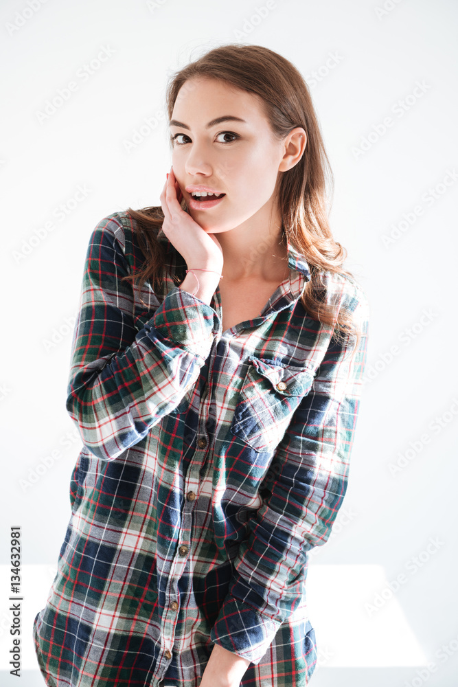 Happy surprised young woman in plaid shirt Happy surprised young woman in plaid shirt