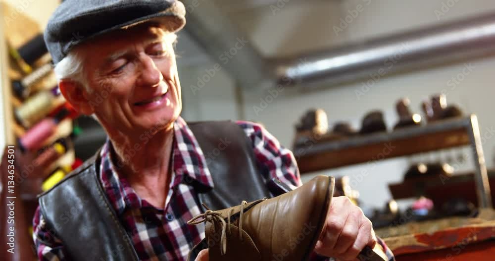 Shoemaker repairing a shoe in workshop 4k