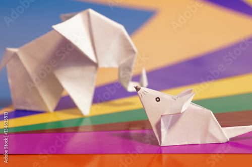   Paper origami mouse isolated on the colorful background