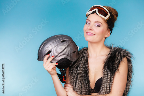 Woman seductive girl in ski googles holds helmet © Voyagerix