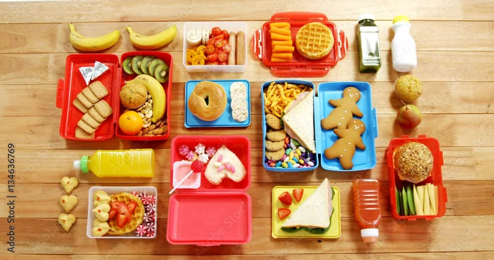 Various sweet foods and fruit in a box on table 4k
