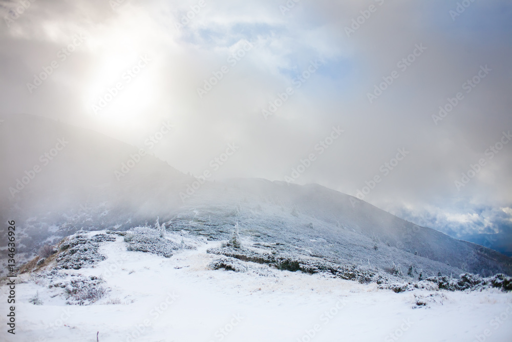 Winter mountains in a fog.