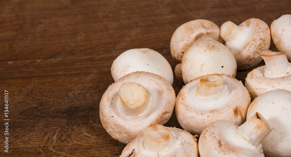 Mushrooms on wooden table with copy space. top view