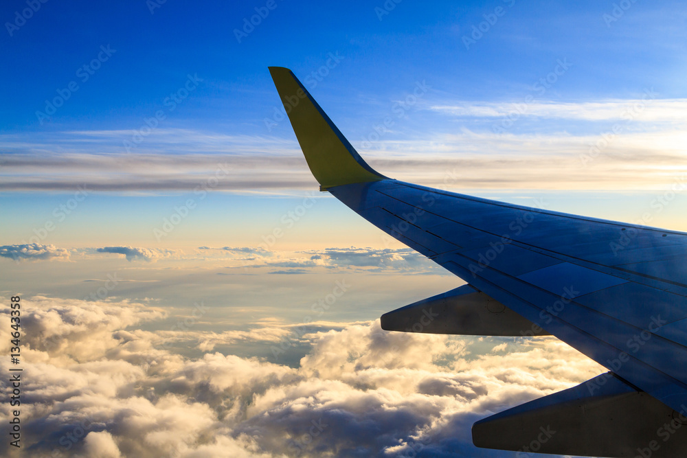 Fototapeta premium View from airplane window at the clouds