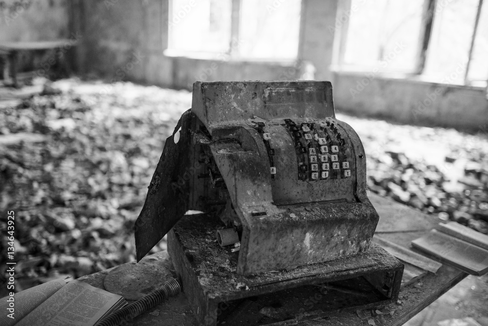 Old rusty soviet calculating machine at Chernobyl city zone of r