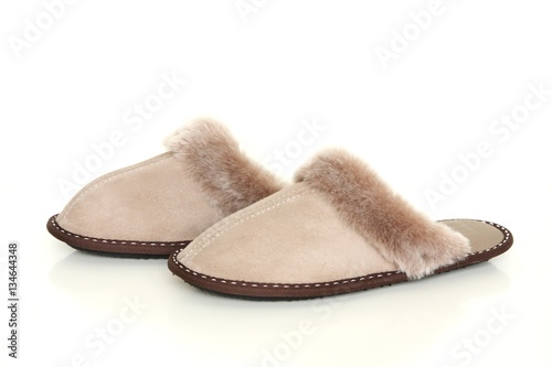 Sheepskin slippers isolated on white background photo