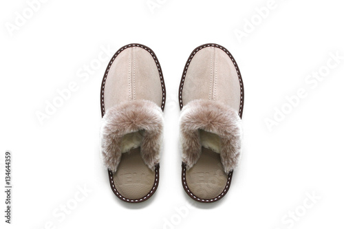 Sheepskin slippers isolated on white background photo