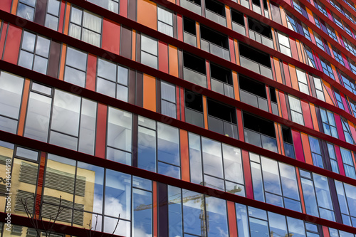 Parallel red lined windows on a business building in Rotterdam, Holland
