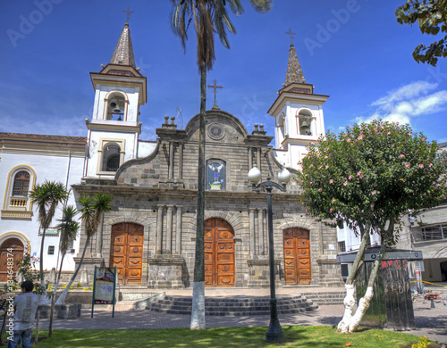 Old colonial church facade, on a sunny morning, blue sky, in Ibarra Ecuador. photo