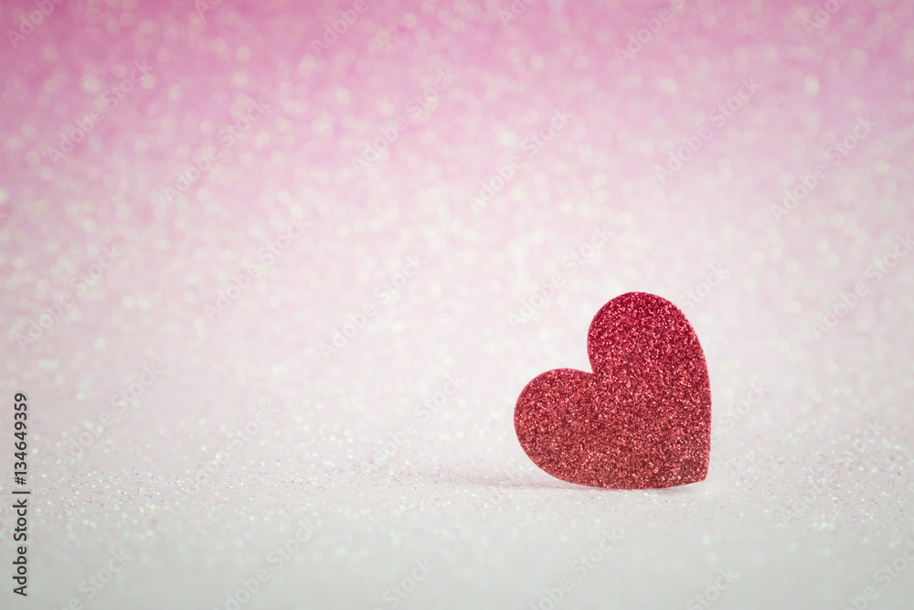 Red heart shapes on pink glitter bokeh light for valentines day background
