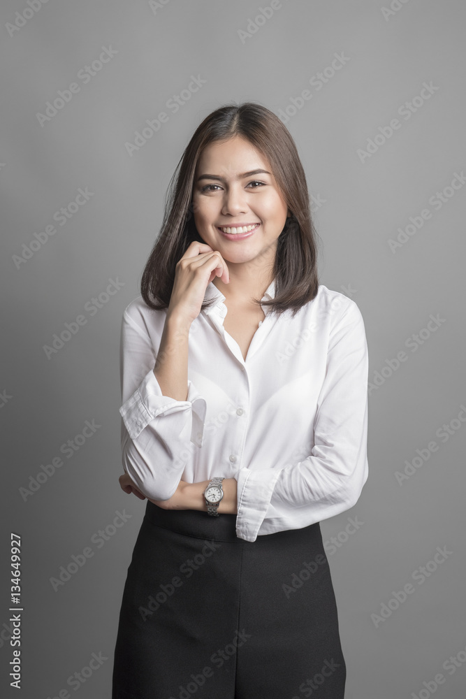 Beautiful Business Woman smiling on grey background Beautiful Business Woman smiling on grey background