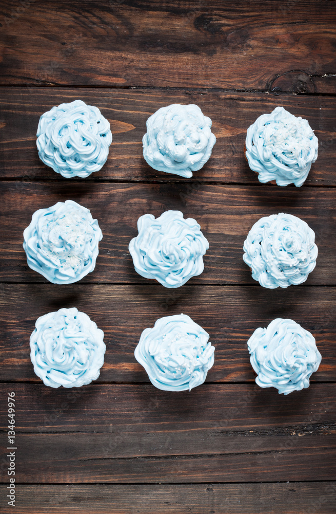 Blue cupcakes on wood vintage background
