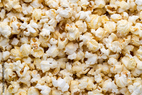 Popcorn background. Caramel sweet corn. Cinema snack.
