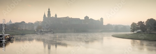 Fototapeta Naklejka Na Ścianę i Meble -  foggy morning on the river before castle