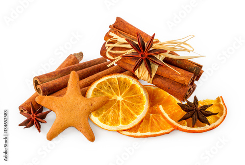 Dried oranges, star anise, cinnamon sticks and gingerbread, isolated on white background