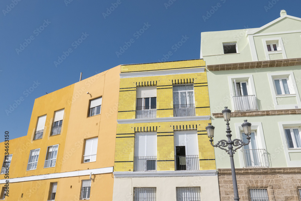 Old colored houses with various colors on facade in Cadiz, Andal