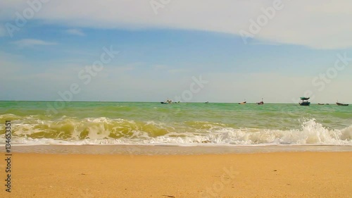 White bubbles created on the beach by ocean waves on seashore Foam bubbles abstract white background. Detergent white foam with some bubbles in it A wave thinning out of the sand of a beach