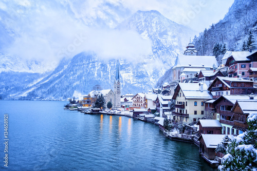 Hallstatt wooden village on lake in snow white, Austria