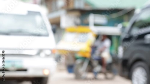 blur in  philippines  people   walking and riding motorbike traffic jam center town . photo