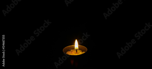 One candle light in the dark