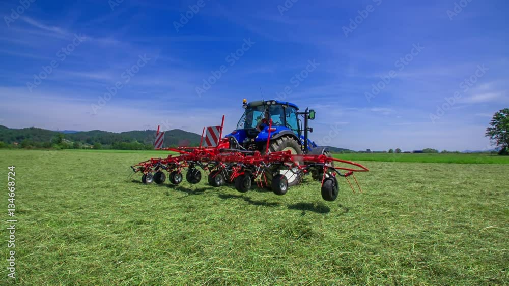 One side of the rotary rakes machinery is opening and a farmer will be able to start preparing hay in the fields.
One side of the rotary rakes machinery is opening and a farmer will be able to start preparing hay in the fields.