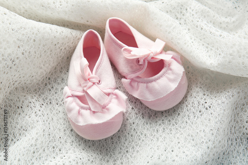 New children shoes on textile background