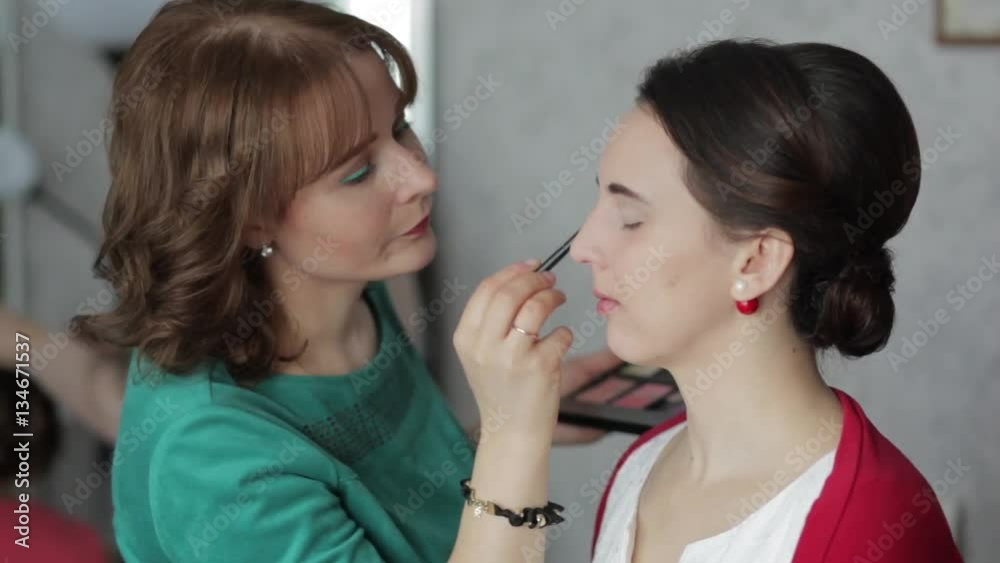 make-up artist working with model make-up artist working with model