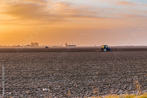 tractor plowing fields