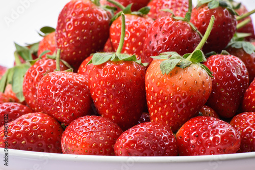 Arrangement ripe strawberry organic on white plate
