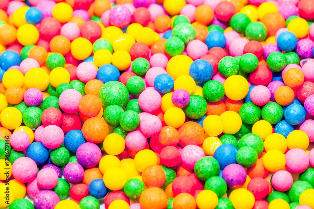 Obraz premium Colorful candies and colorful confetti background