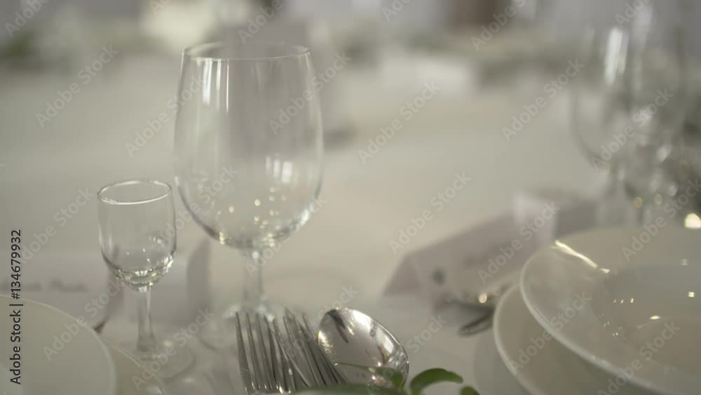 Table with wine glasses of wedding arrangement at he sunset. Table with wine glasses of wedding arrangement at he sunset.