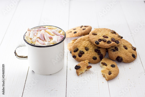 Cup of hot cocoa  with color marshmallow and oatmeal cookies