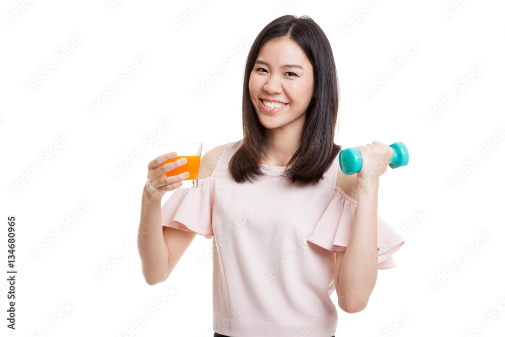 Young Asian woman with dumbbell drink orange juice. Young Asian woman with dumbbell drink orange juice.