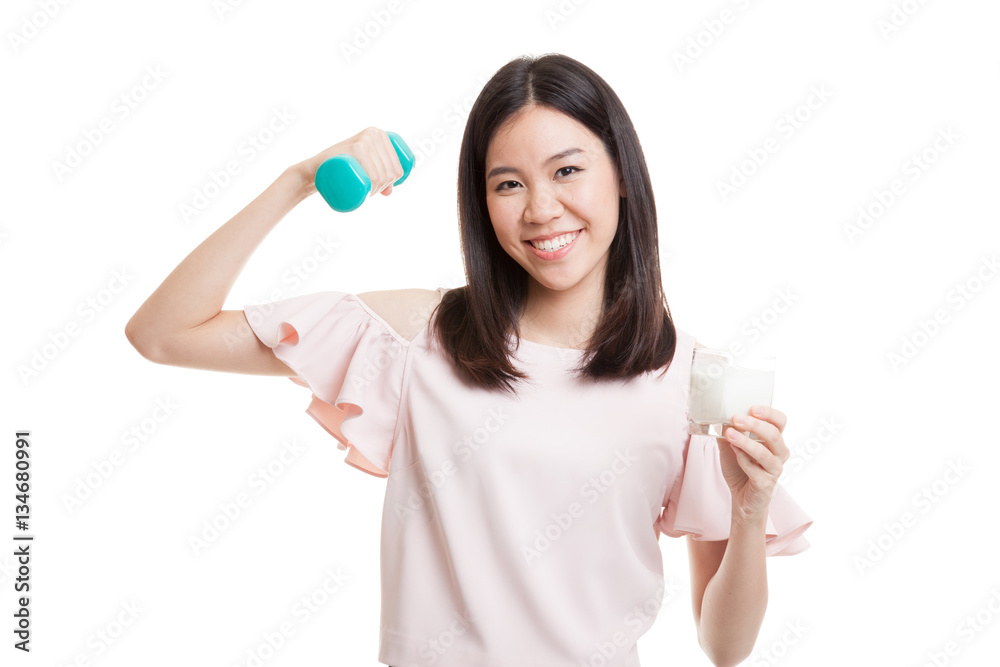 Healthy Asian woman drinking a glass of milk and dumbbell. Healthy Asian woman drinking a glass of milk and dumbbell.