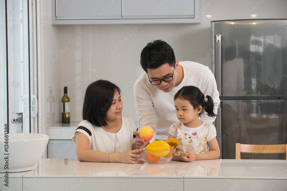 asian family cooking at kitchen