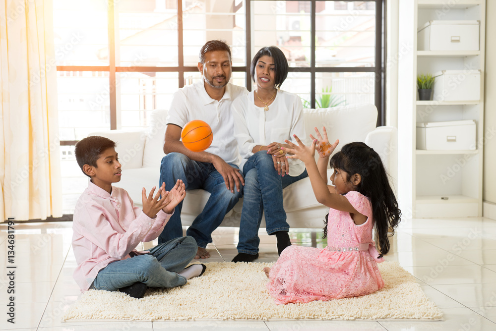 © wong yu liang - indian family playing with ball in living room © wong yu liang - indian family playing with ball in living room